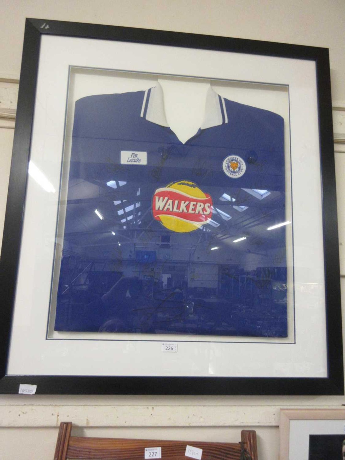 A framed and glazed display of signed 2009/2010 Leicester City football shirt