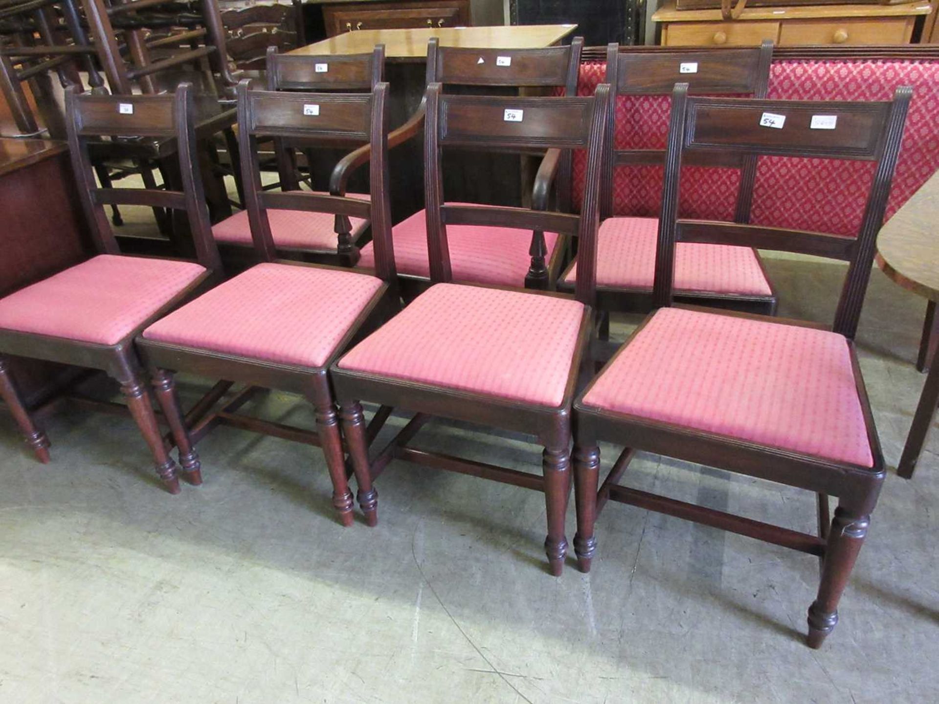 A set of seven (Six plus one) early 19th century mahogany dining chairs, the reeded frame over red
