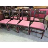 A set of seven (Six plus one) early 19th century mahogany dining chairs, the reeded frame over red