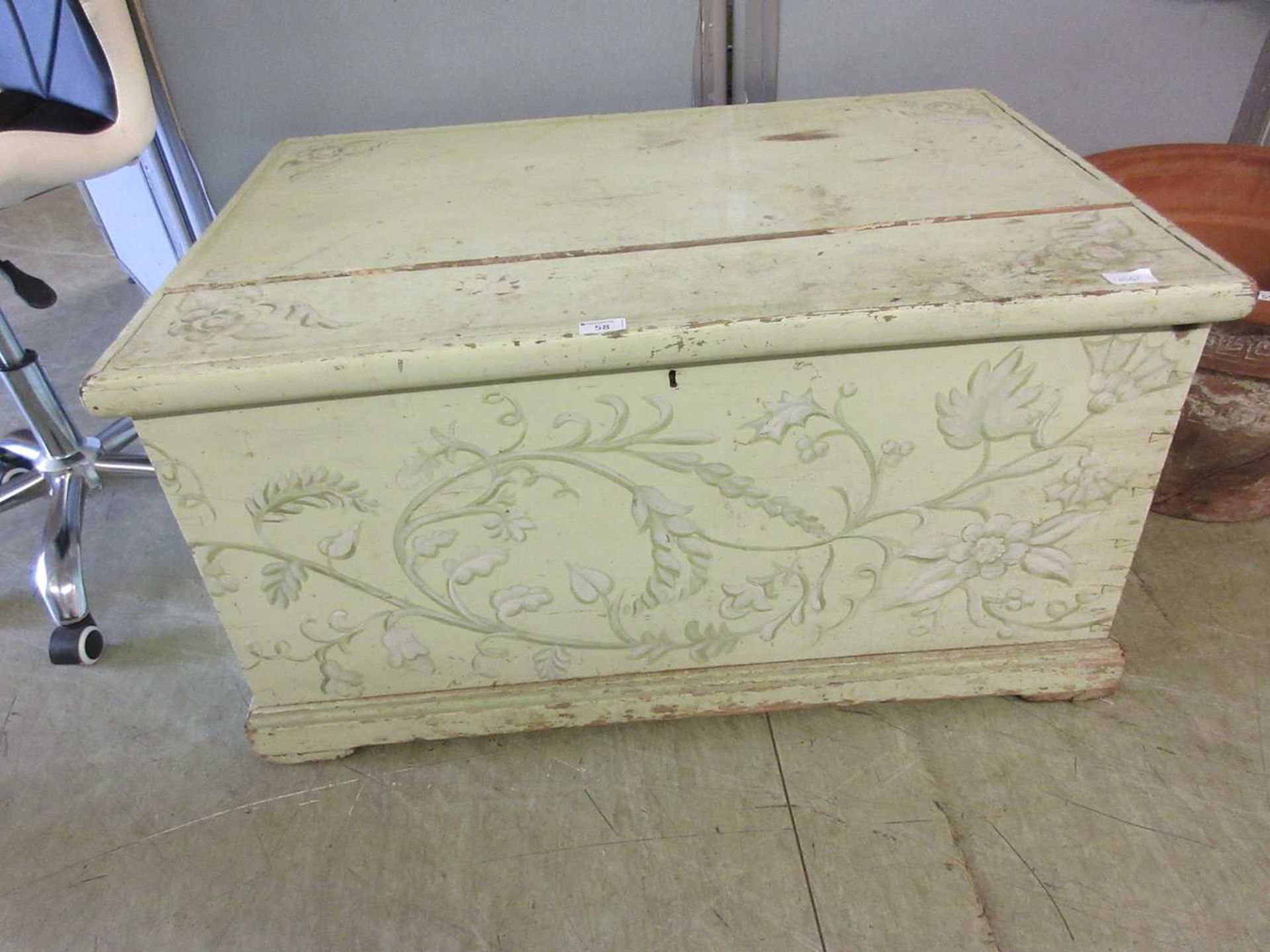 A 19th century painted pine trunk with light green floral decoration