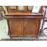 A Victorian mahogany side cabinet, the banded top over two drawers and two cupboard doors flanked by