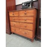 A 19th century satin and birch chest of two short over three long drawers on turned feet