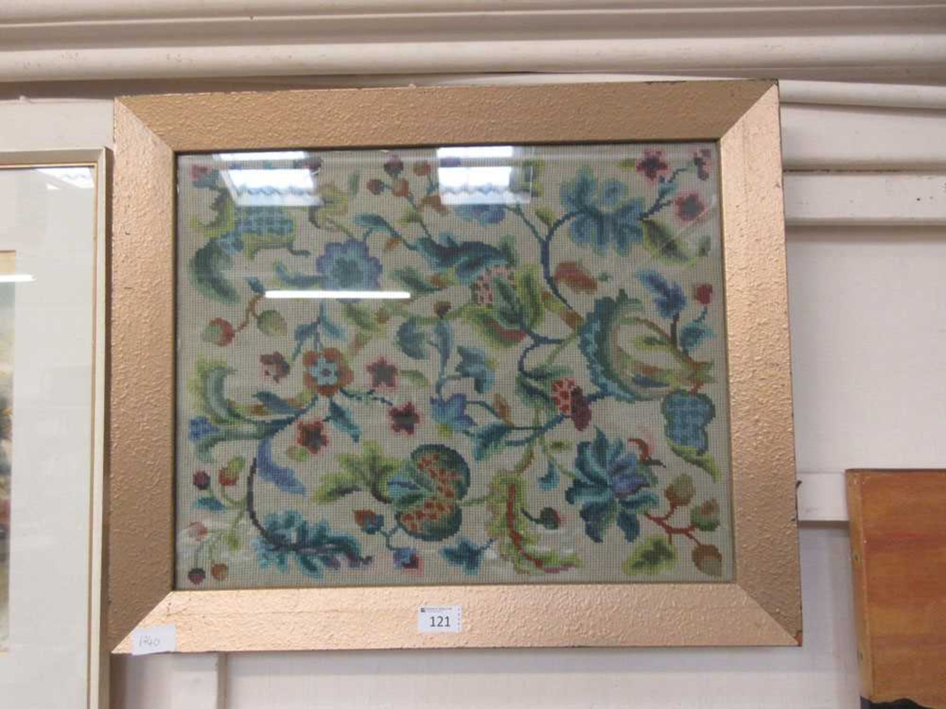 A framed and glazed needlework with floral design