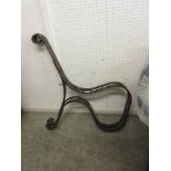 Two wrought iron bench ends