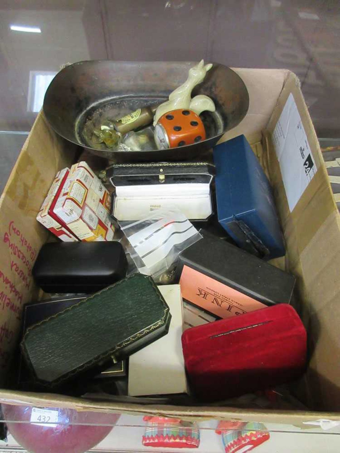 A box containing a quantity of cased cuff links along with collectible items