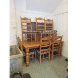 A modern kitchen table along with six matching chairs