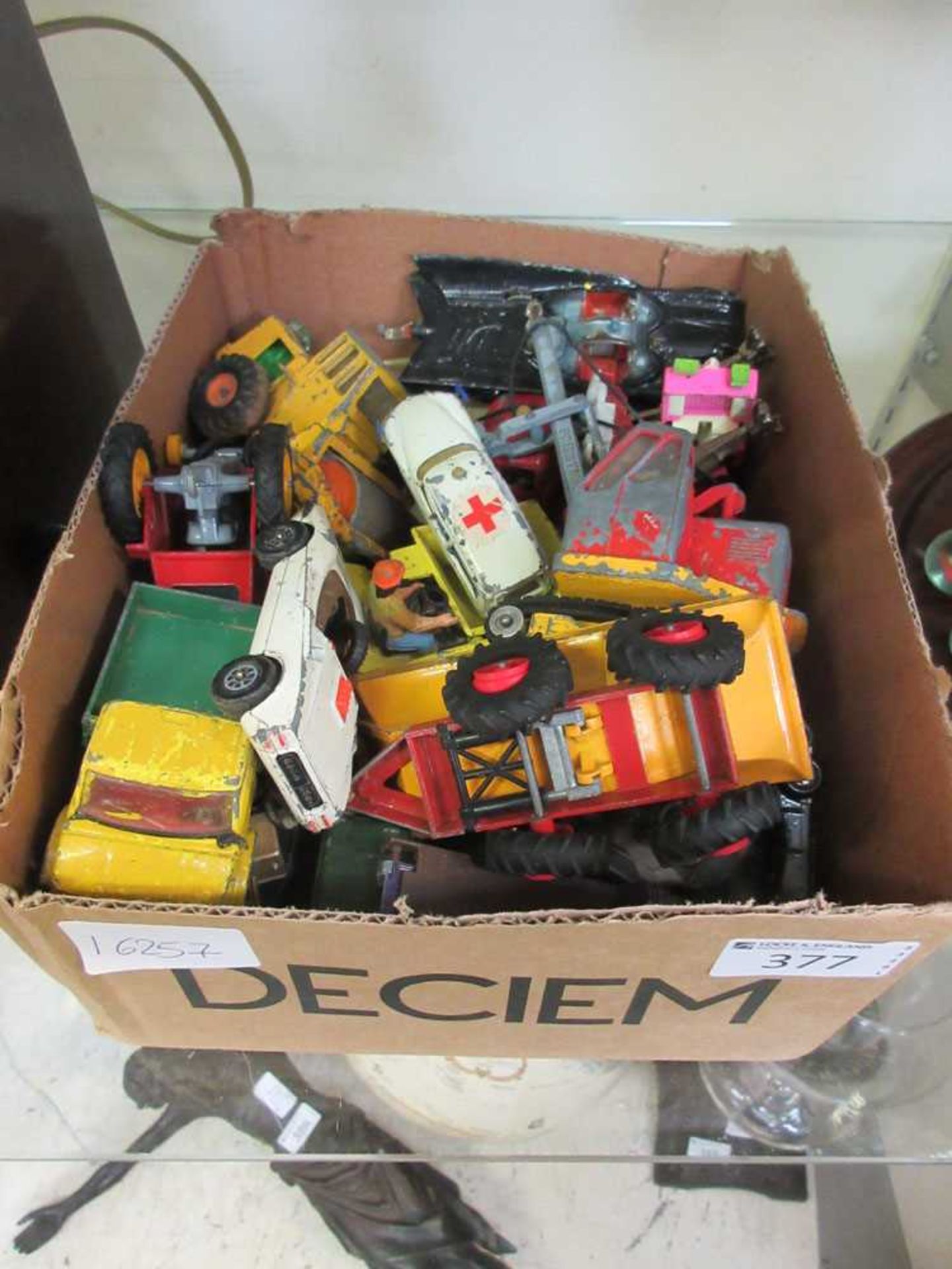 A box containing a quantity of die cast cars, trucks, etc, to include Batman