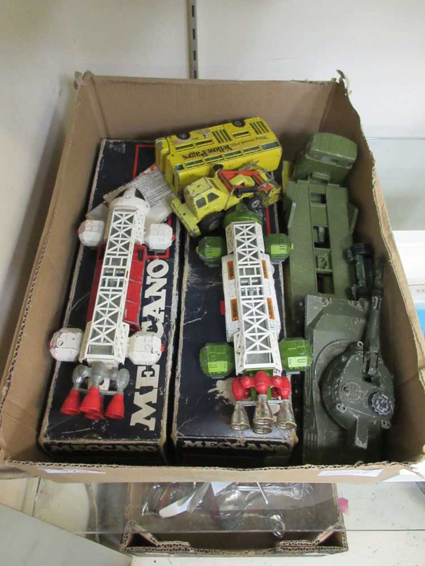 A box containing die cast models to include Dinky, Meccano conversions sets, etc