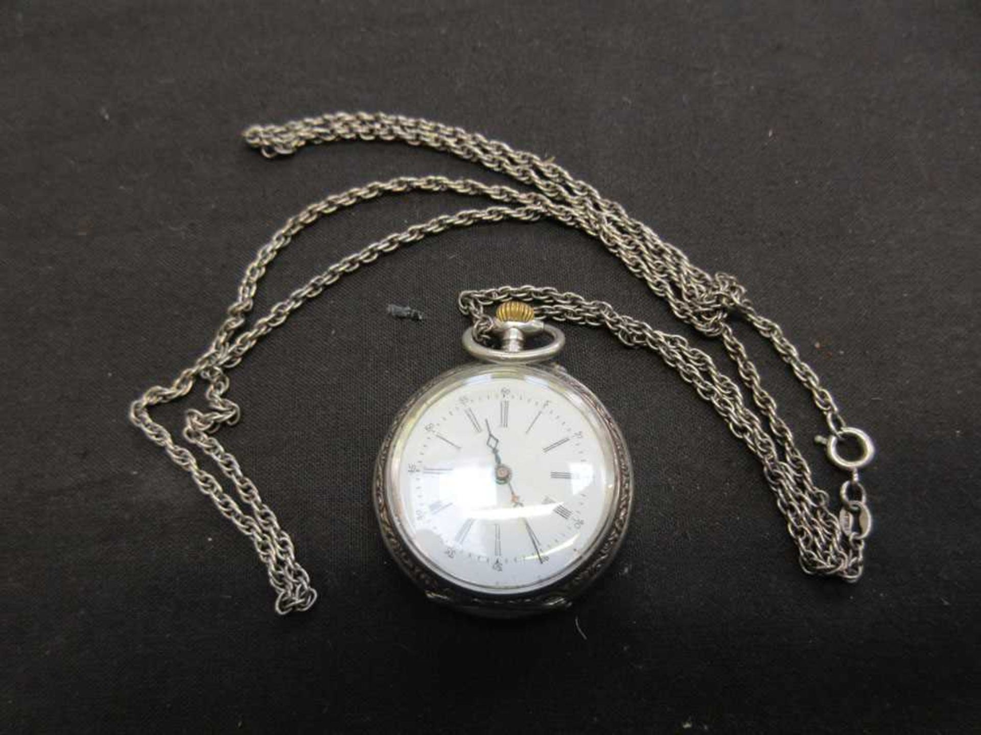 A continental miniature white metal pocket watch marked '800'