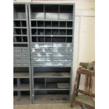 A grey metal workshop shelving unit comprising of pigeon holes, drawers and shelves
