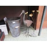 A metalwork ornamental bird, bucket and bells