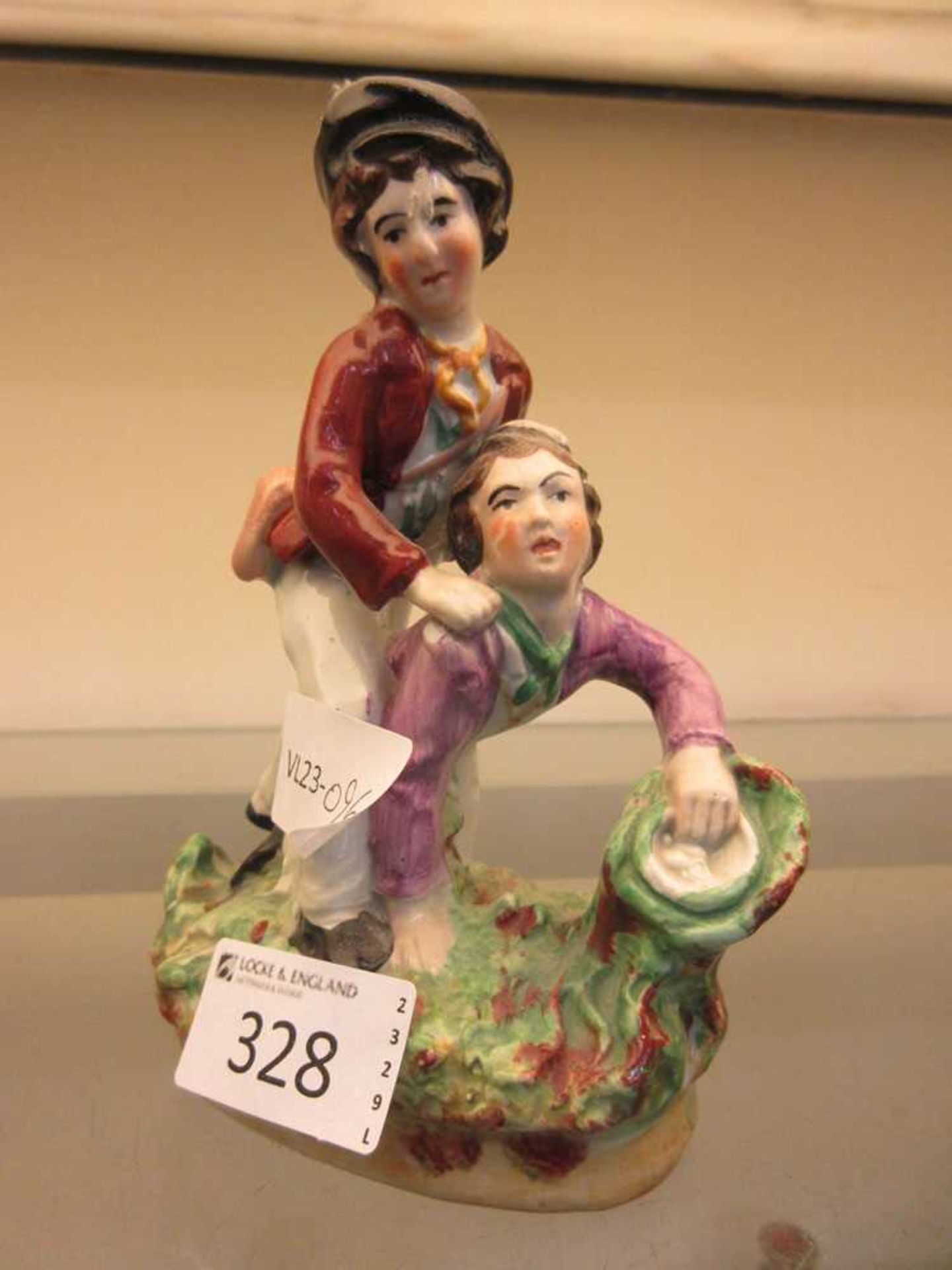 A Staffordshire figural group of two boys playing