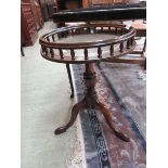 A reproduction mahogany occasional table