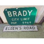An American town sign for 'Brady' along with a street sign for 'Ellen's Road'