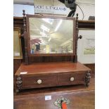 A late 18th century mahogany toilet mirror with trinket drawers to base