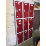 Three banks of three red and grey lockers