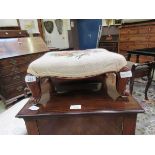 A 19th century mahogany foot stool with floral needlework upholstery