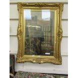 An ornate gilt framed and glazed oil painting of child looking at painting signed Thomas Webster RA
