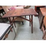 An early 20th century oak folding 'campaign' table