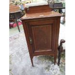 An early 20th century mahogany and boxwood strung pot cupboard