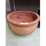 A large terracotta garden pot 52 cm diamter, 32.5 cm high