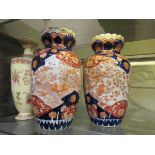 A pair of Japanese Imari palette vases