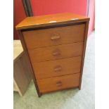 A teak four drawer bedroom chest