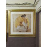 A large gilt framed print of lady with flower