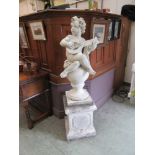 A weathered stoneware cherub on matching plinth