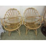 A pair of cane conservatory chair frames