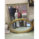 Two framed bevel glass wall mirrors