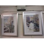 A pair of silvered framed prints depicting Venice