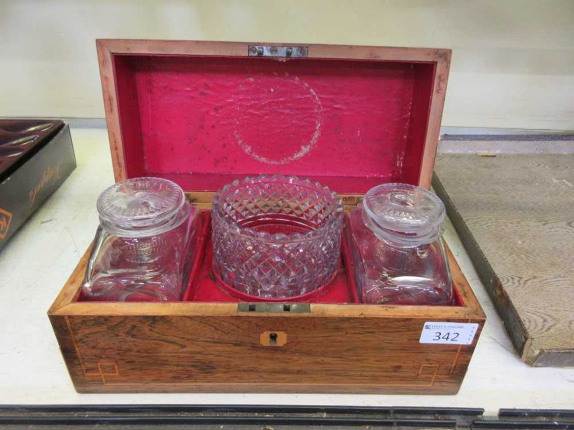A rosewood and strung tea caddy with two glass caddies and mixing bowl (A/F)