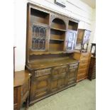 An Old Charm oak dresser, the plate rack with leaded glazed doors over the base with cupboards and