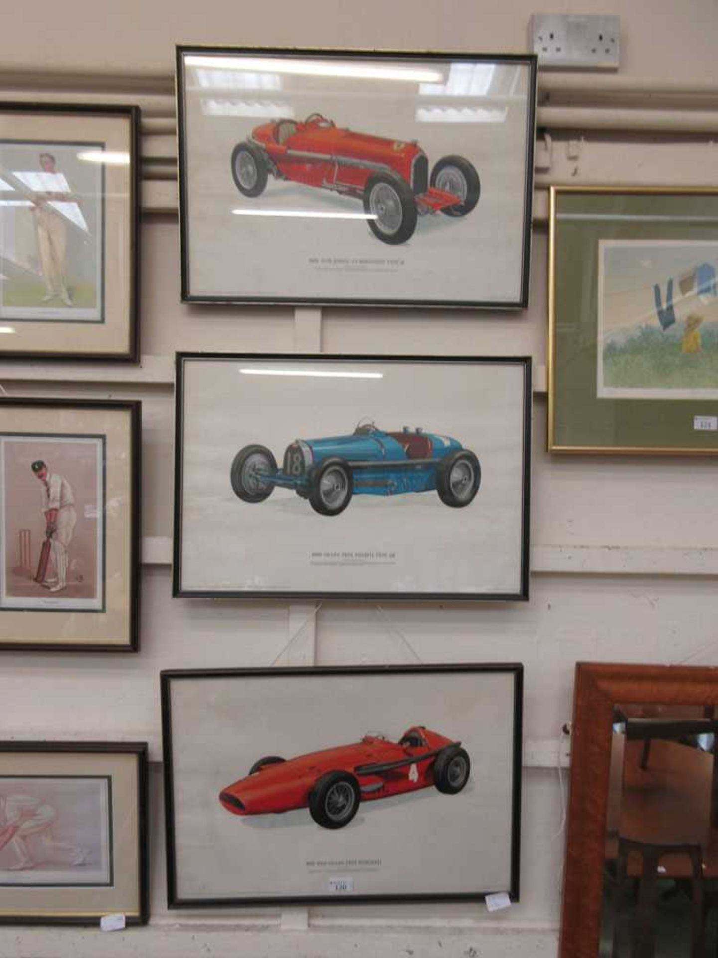 A set of three framed and glazed prints of Gran Prix cars from the 1930s and 1950s