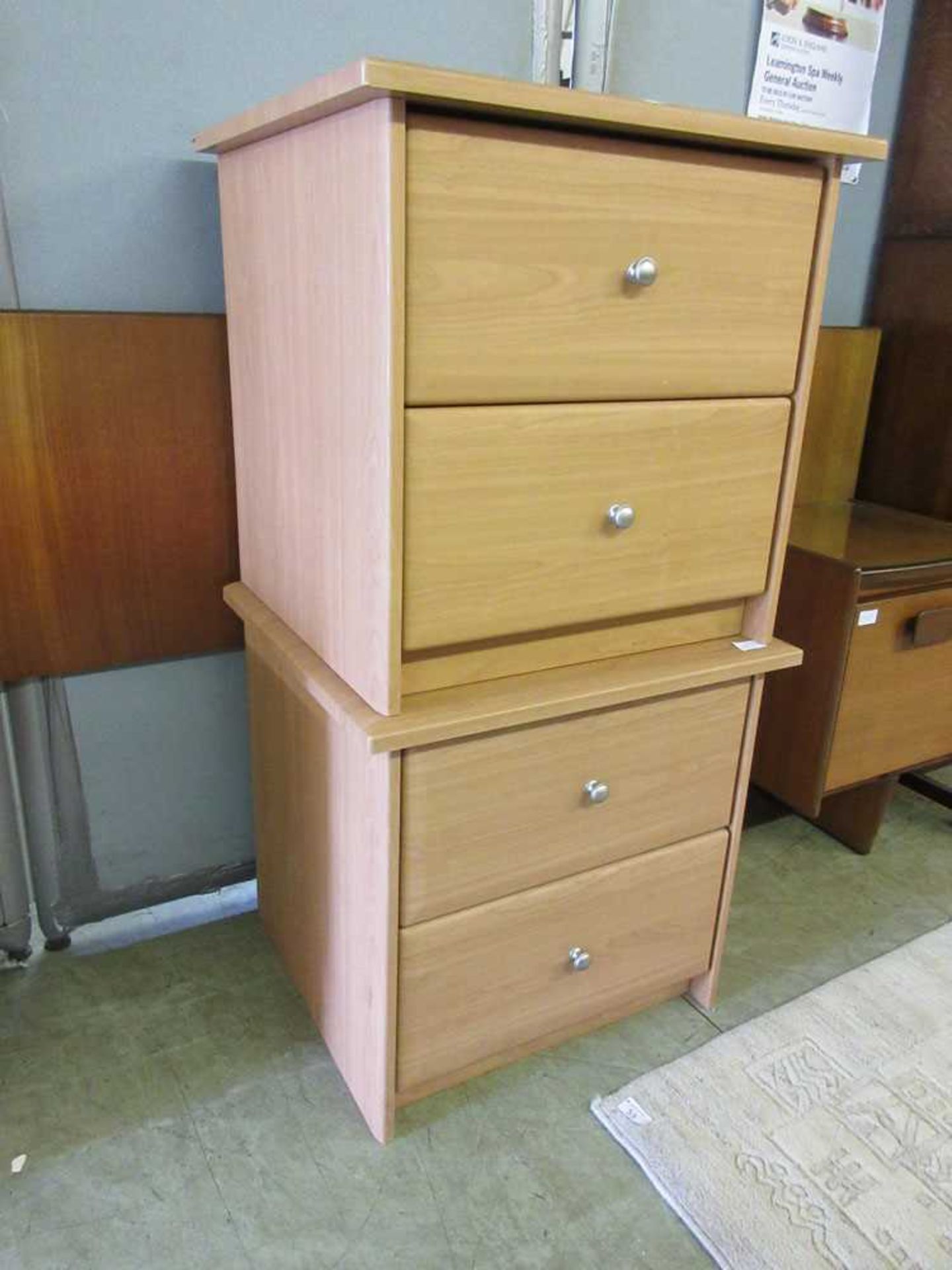 A pair of modern laminate bedside chests