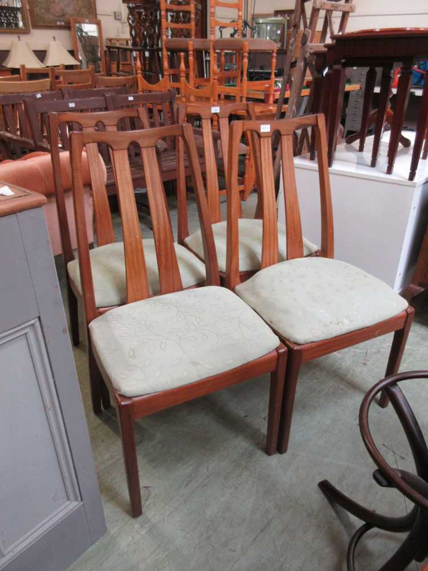 A set of four mid-20th century teak dining chairs by Nathan