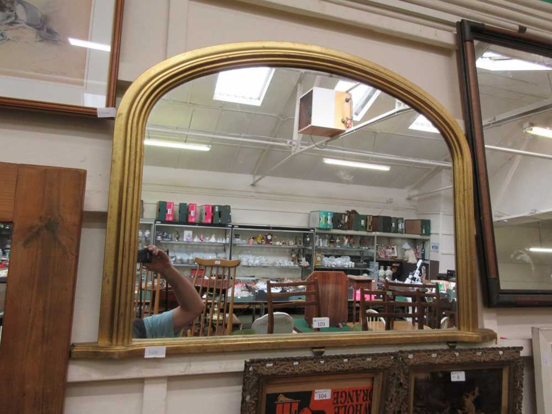 A modern gilt framed over mantle mirror