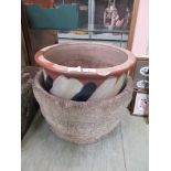 A glazed garden pot along with one other