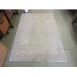 A modern beige ground rug