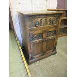 An Old Charm style oak media cabinet