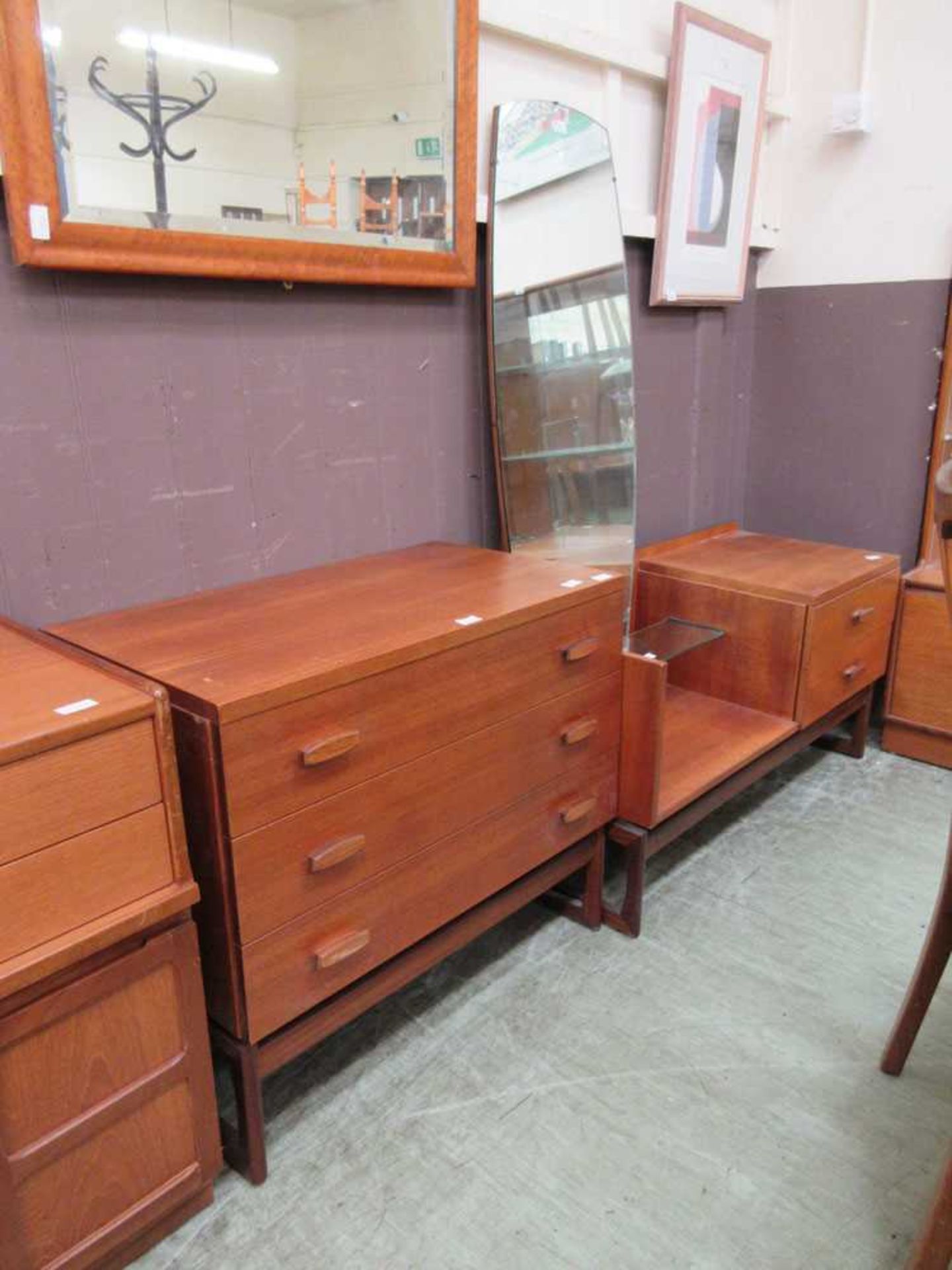 A mid-20th century teak chest of three drawers along with a matching dressing table by G-Plan