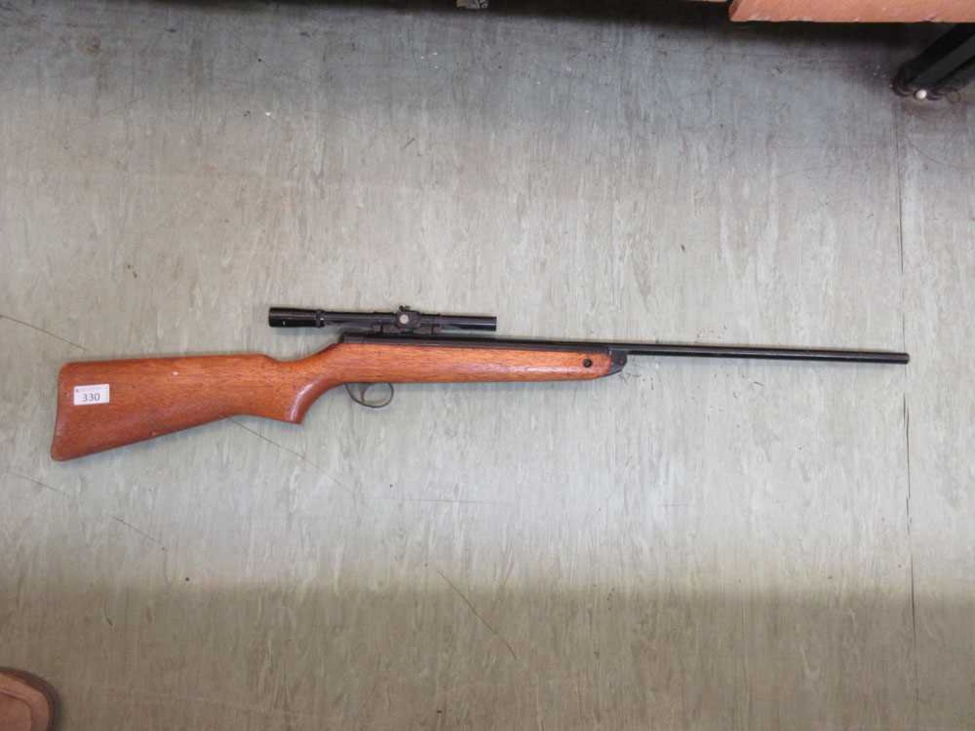 A BSA air rifle with Armex 4x15 scope attached Unsure of model. Barrel slightly rusted. Unsure of