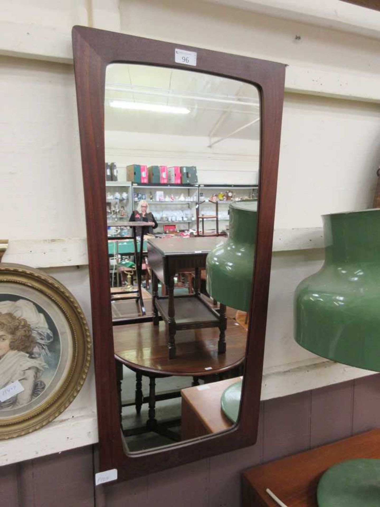 A mid-20th century teak framed mirror