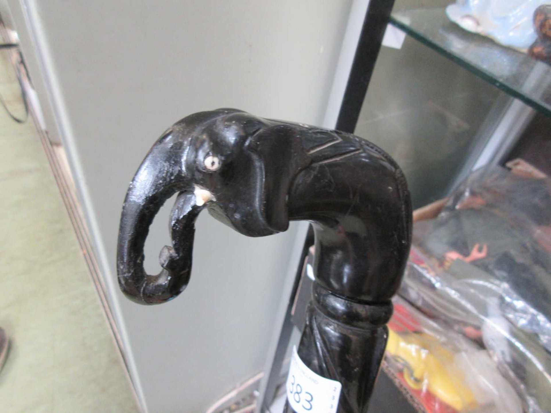 A carved ebony walking stick with elephant design handle Length: 95cm. - Image 3 of 4