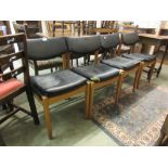 A set of four beech framed and Rexine upholstered dining chairs (A/F)