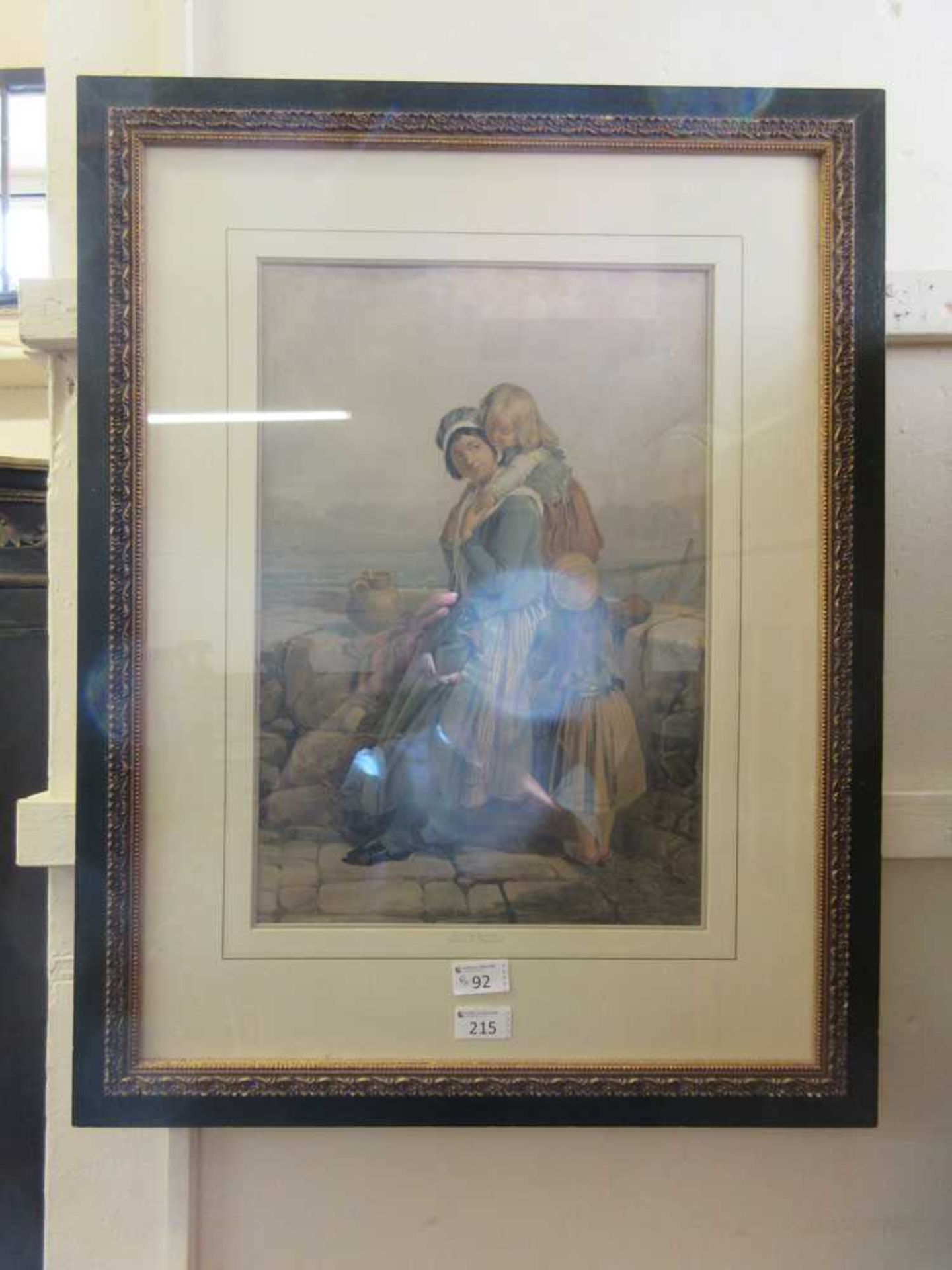 A framed and glazed print of mother and children