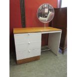 A late 20th century laminate and teak dressing table