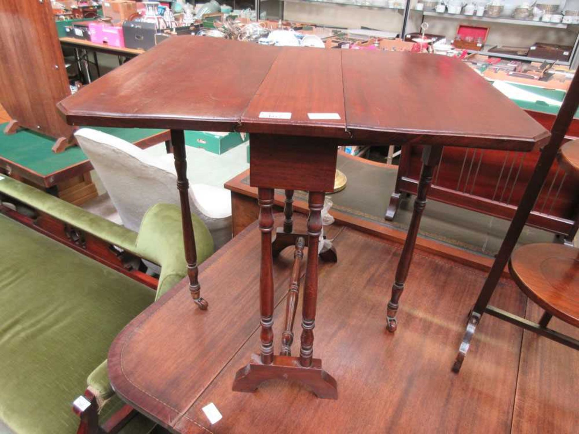 An early 20th century mahogany small scale Sutherland table