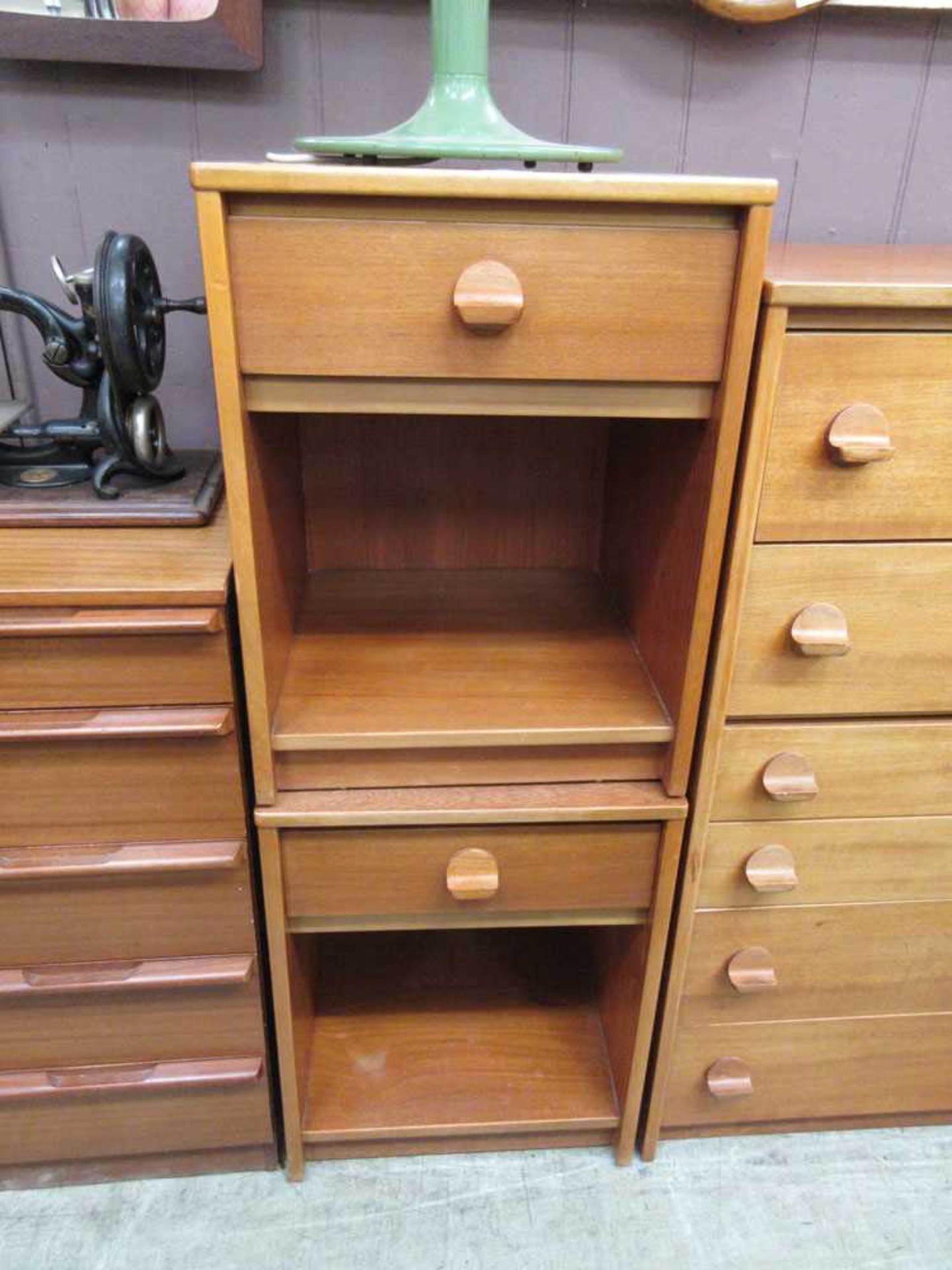 A pair of mid-20th century teak bedside cabinets